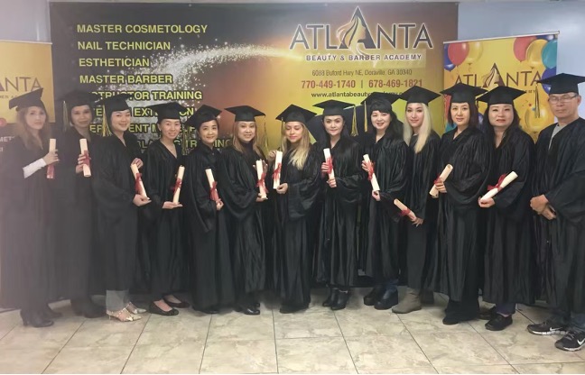 The graduating class at the Atlanta Beauty & Barber Academy