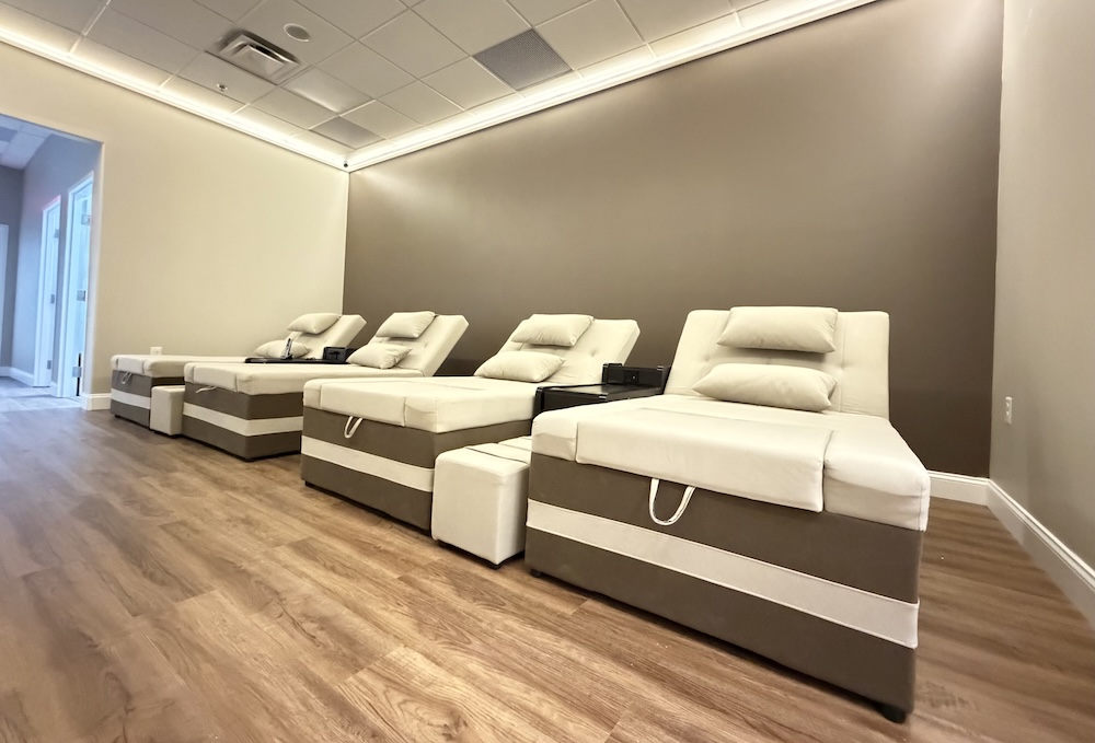 The foot massage room, with four reclining chairs along the wall
